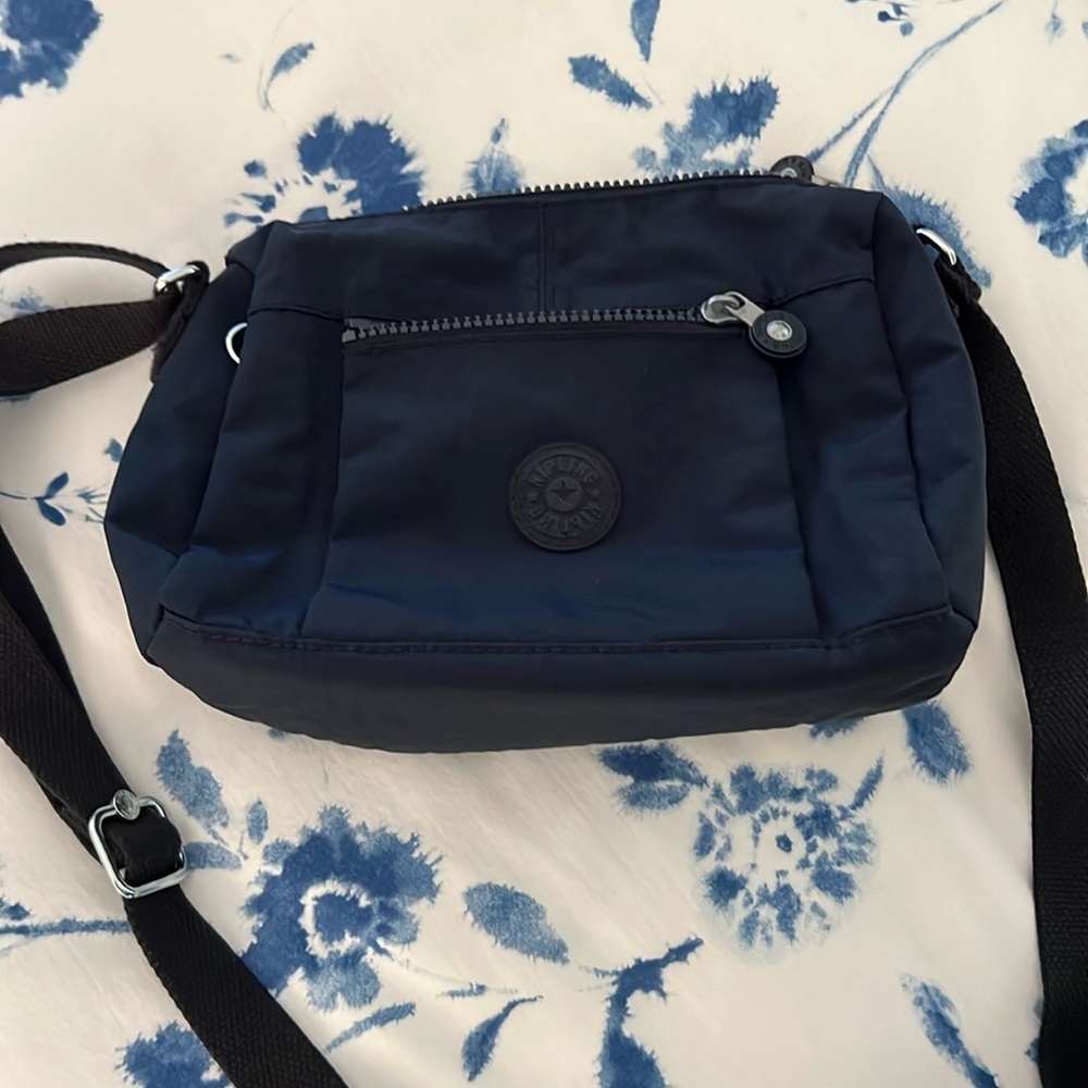 7”x11” navy blue canvas Kipling small purse with adjustable crossbody strap